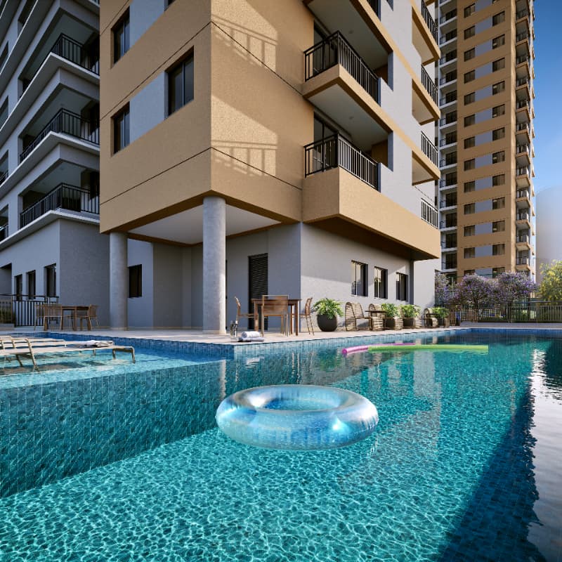 Detalhe da piscina com boia circular e edifício residencial ao fundo.