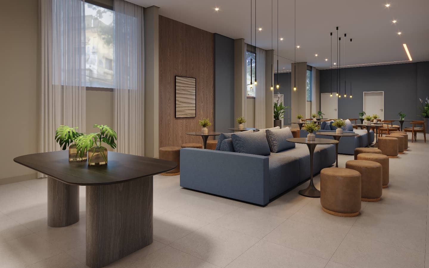 Sala de espera com sofas azuis, poltronas e mesas de apoio com iluminacao pendente