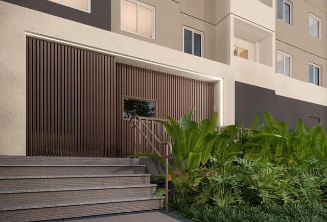Detalhe da fachada com portaria, paisagismo e escadaria de acesso